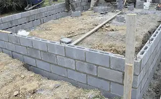 Professionals building a foundation with blocks in ,